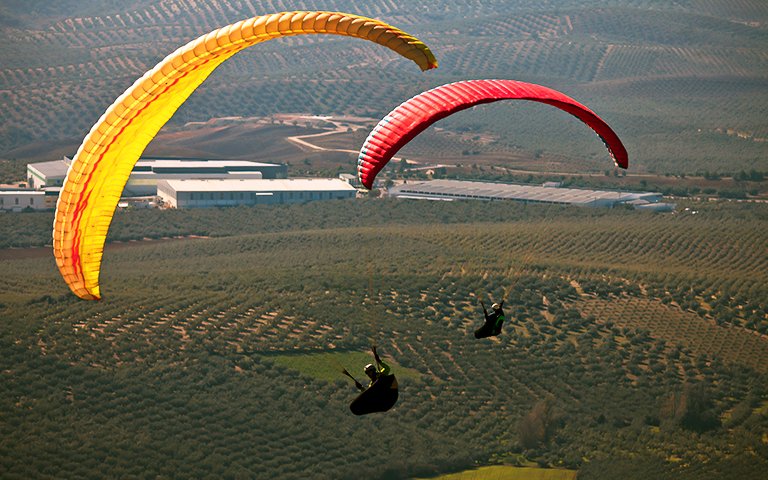 Man practicing paragliding extreme sport
